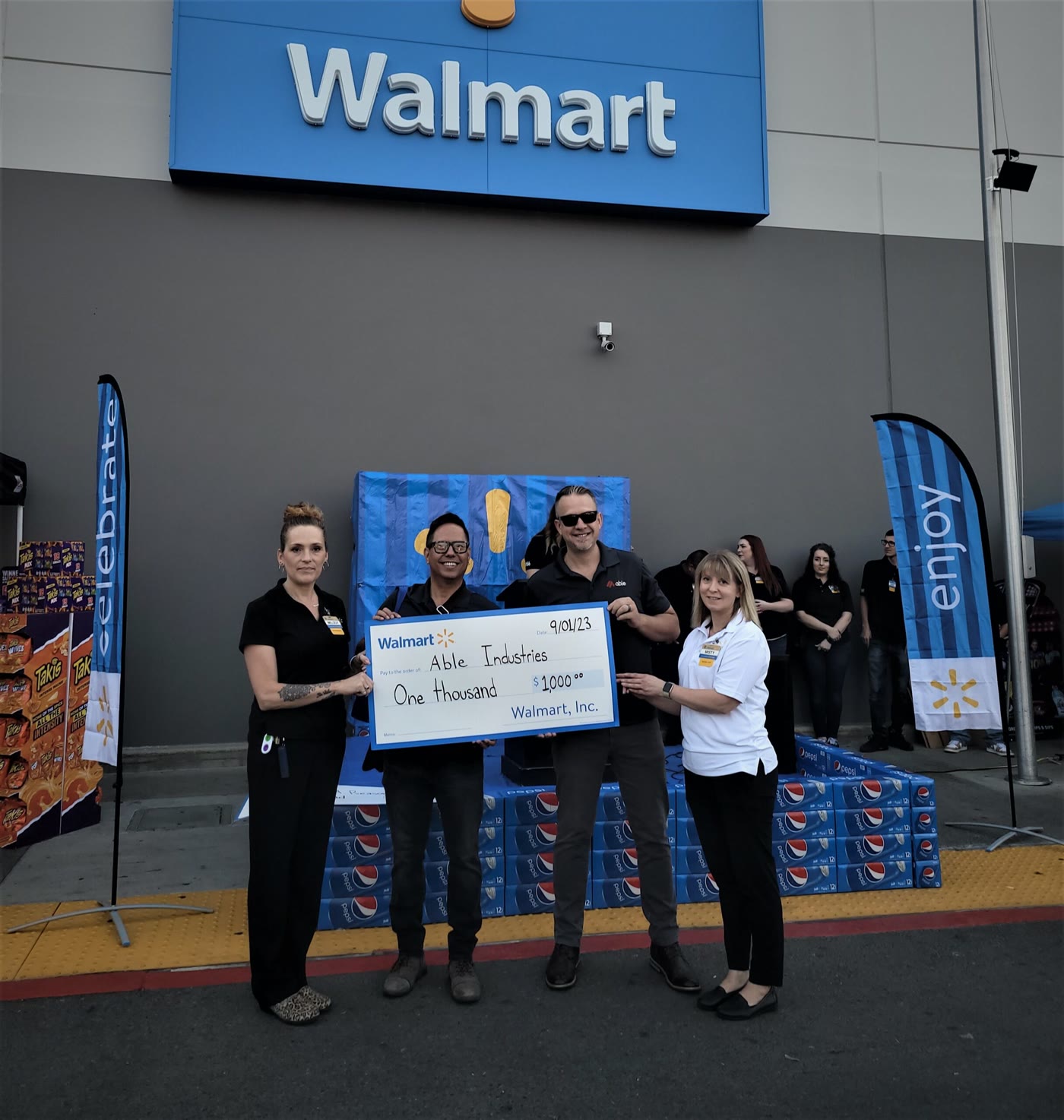 Able Industries receiving a donation cheque from Walmart